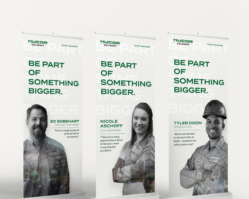 Three vertical Nucor Vulcraft trade show recruitment banner images. Image on far left shows smiling Project Manager Ed Sobehart, middle banner image features Civil Engineer Nicole Aschoff, and banner image at right shows smiling Tyler Dixon, Production. Text on each banner reads "Be Part of Something Bigger." and features the Nucor Vulcraft logo and a quote from each featured teammate.